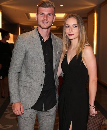 Timo Werner and his girlfriend Julia Nagler pose for a picture.